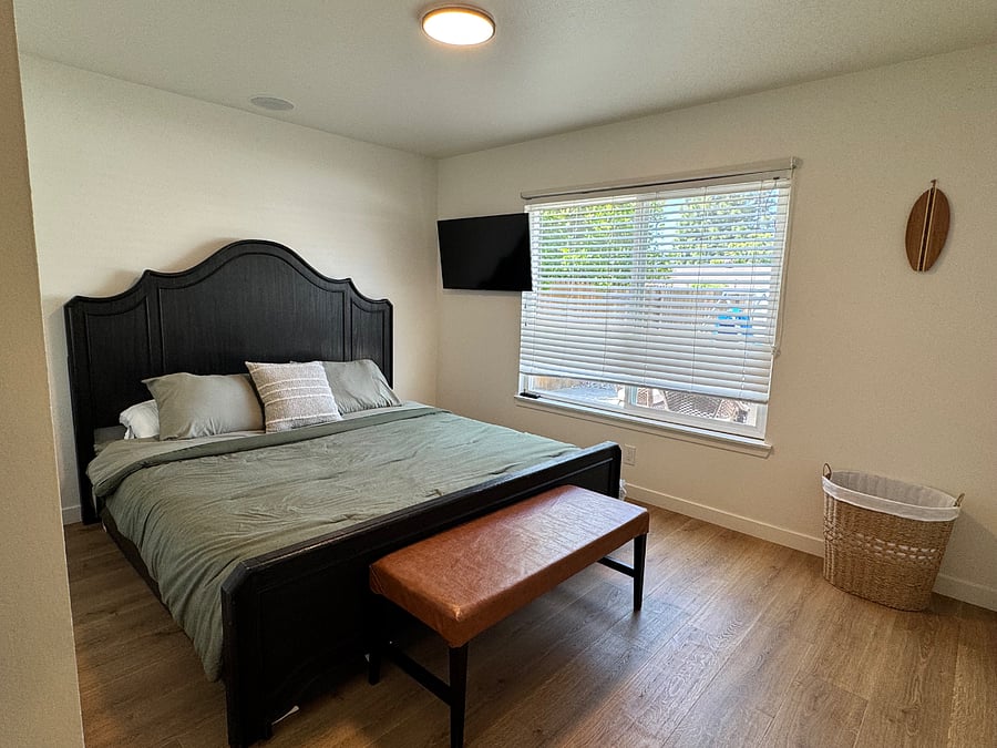 master bedroom with king bed, view of back yard