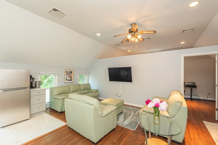 Relax in the bright & airy living room while enjoying your favorite movie on the 55" TV.