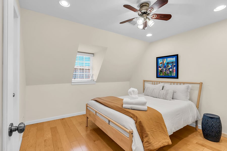 Cozy and light, this queen bed is extra welcoming!