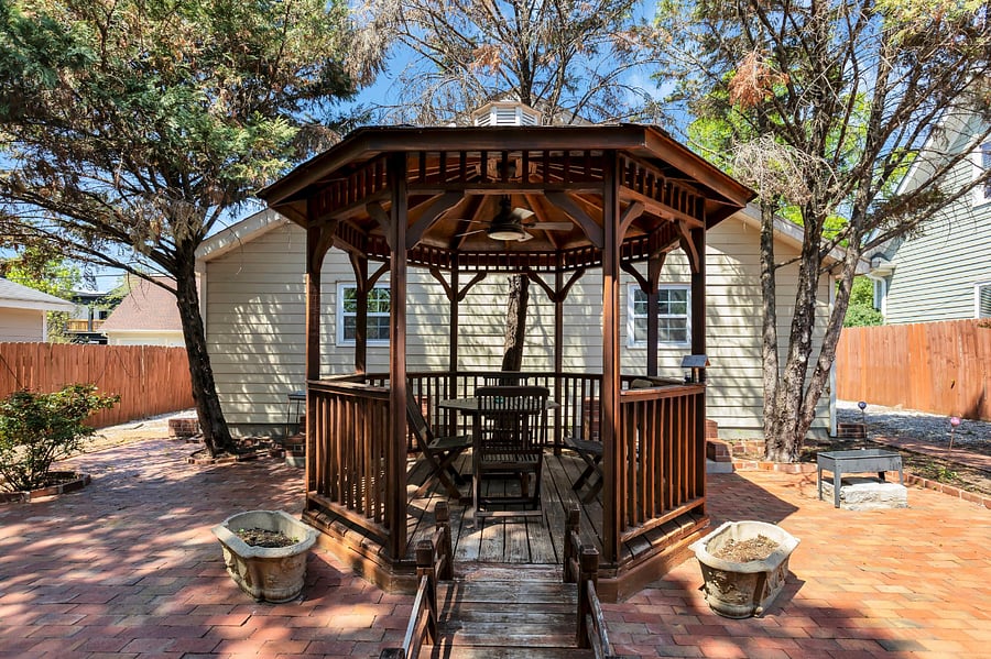 View from the front door- gazebo and garage. It's giving Eastie. 
