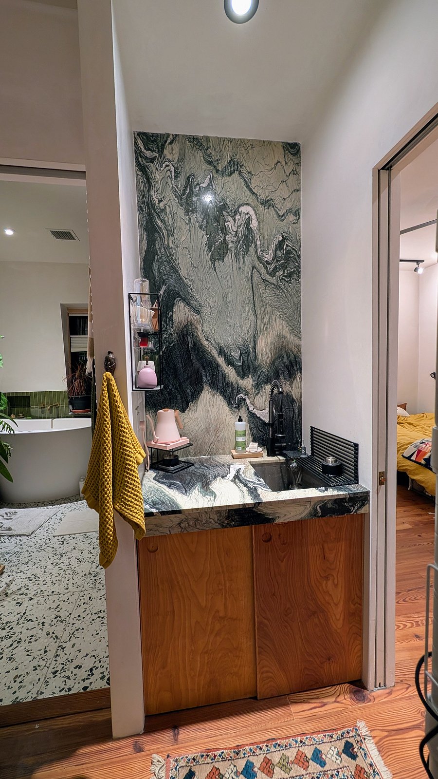 Suite includes a wetbar with mini-fridge