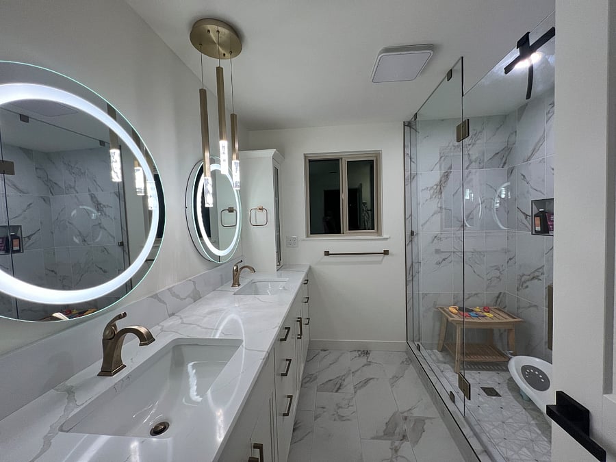 His and her vanity with tons of storage and outlets! Beautiful glass door shower with 4 foot wide shampoo niche.