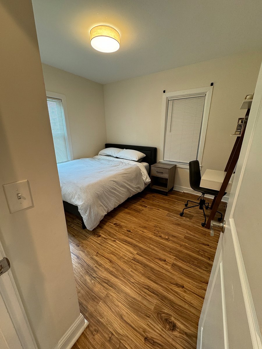 Master bedroom with work desk and en suite bathroom.