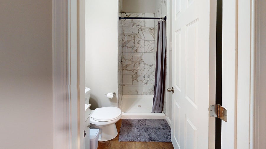 Room 6 - Private newly renovated bathroom with stand up shower, gorgeous tile and bright lighting.