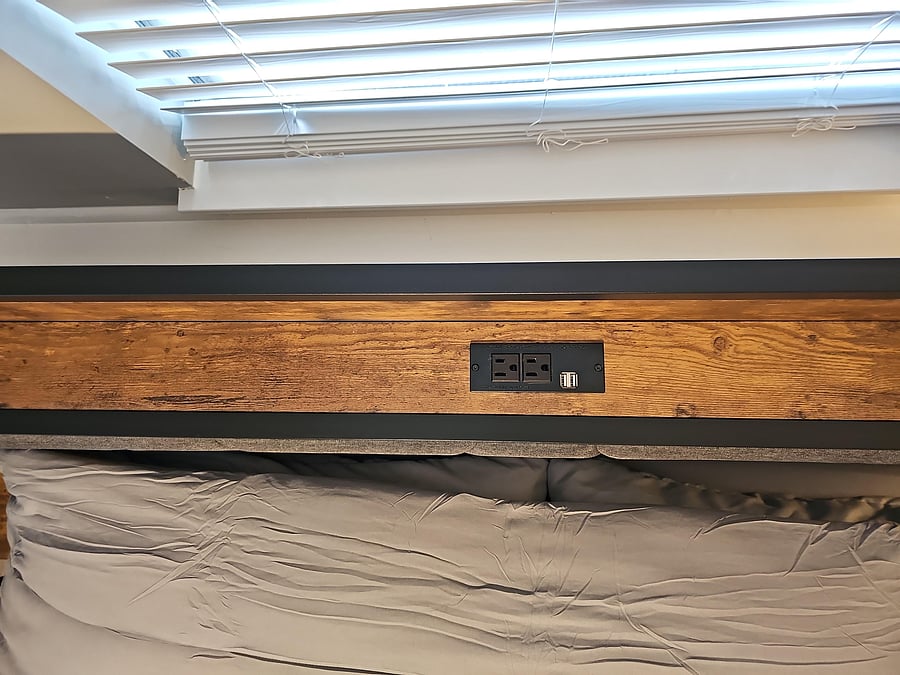 Plug and USB outlets in headboard.