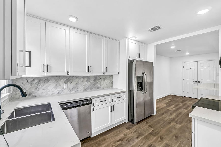 Fully equipped kitchen has labeled cabinets for each room number 1-5