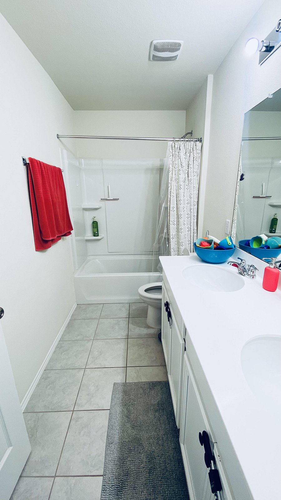 Large shared upstairs bathroom with dual sinks and full tub. Clean & quiet home.