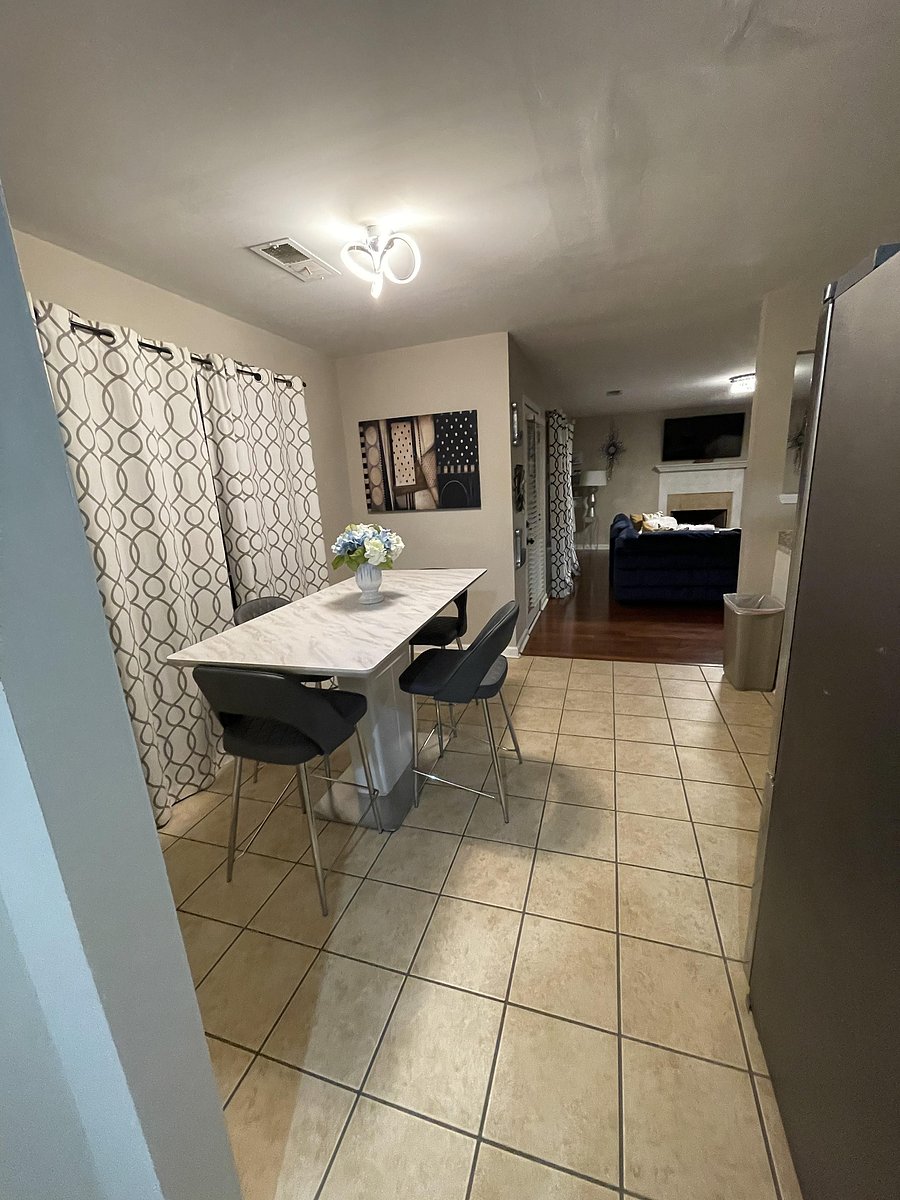 Dining room with modern table and chairs.