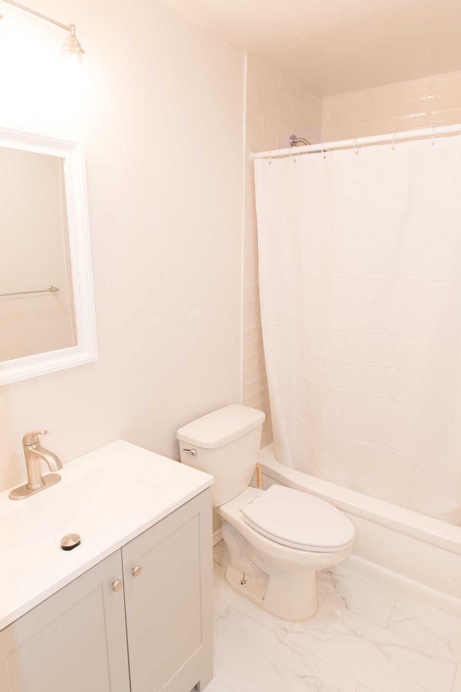 Shared bathroom with tub.