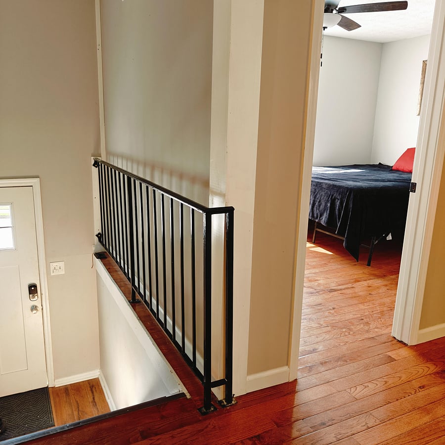 view of room from kitchen and front door of house is to the left.