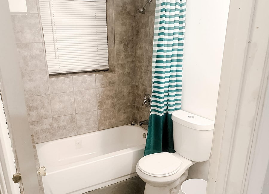 Downstairs bath for washer/dryer area. Tub/shower combo.