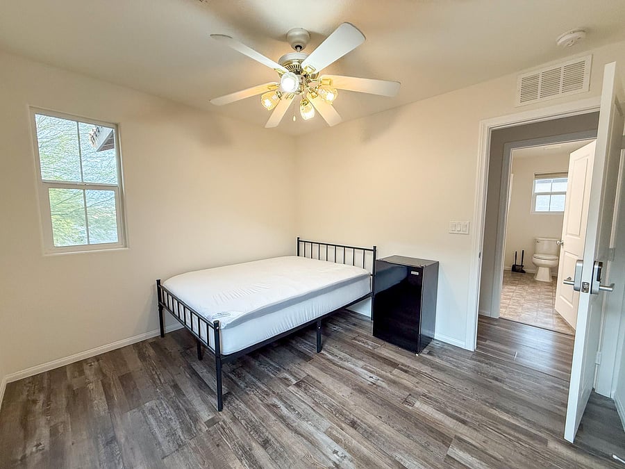 Bedroom #4 with Ceiling fan and mini fridge