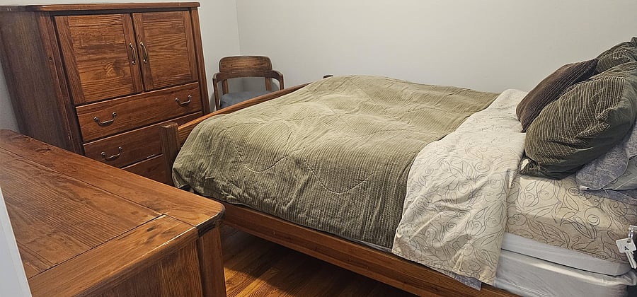 Queen bed with shared bathroom