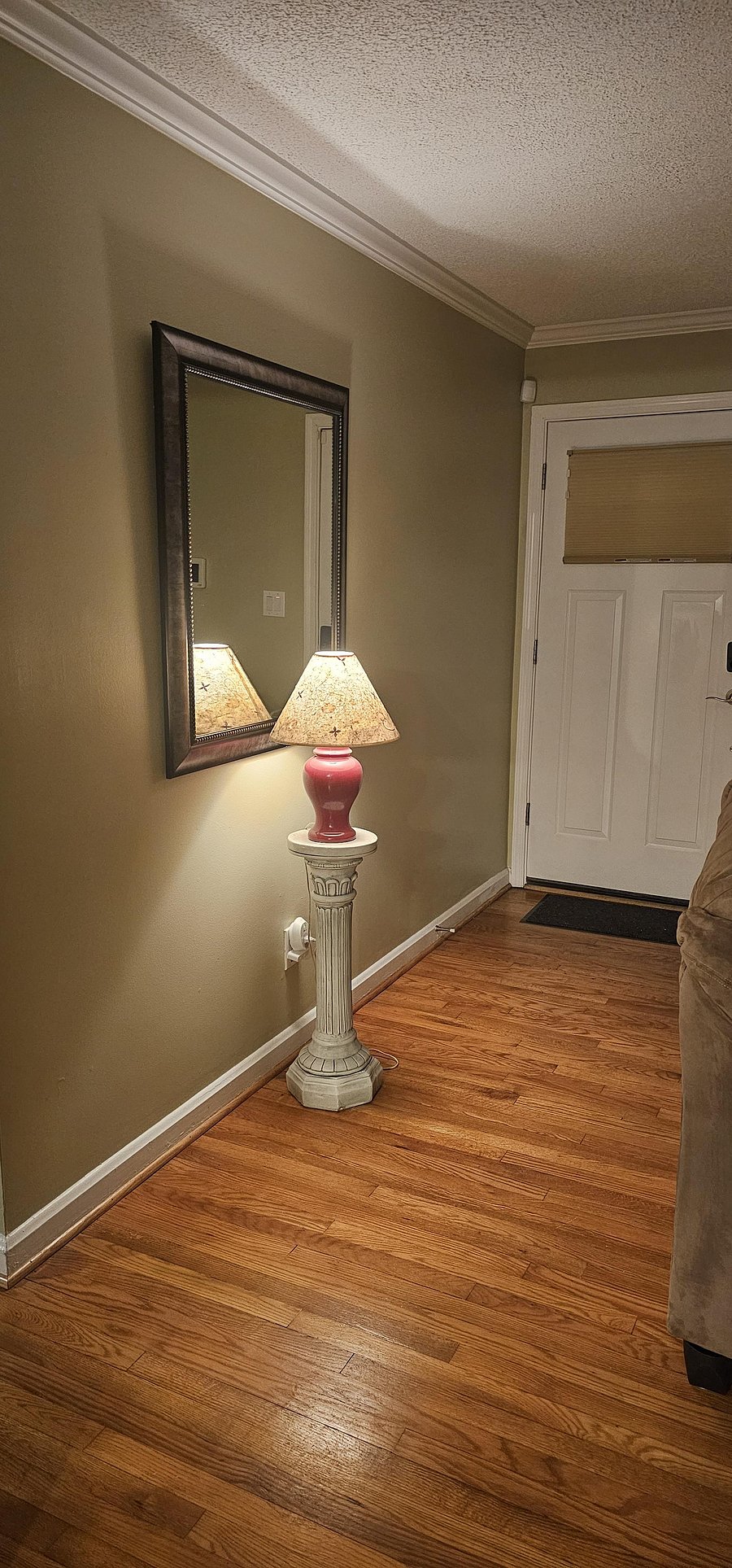 Inside the front door.
