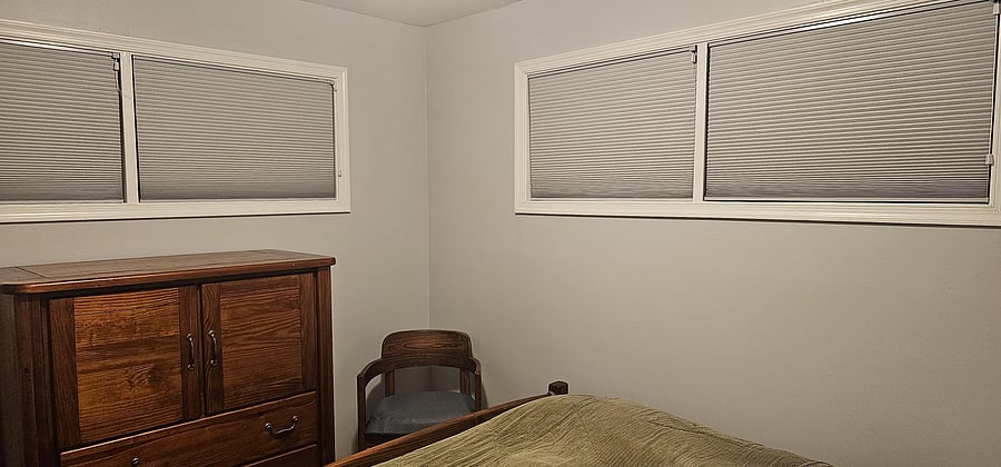 Queen bed with shared bathroom