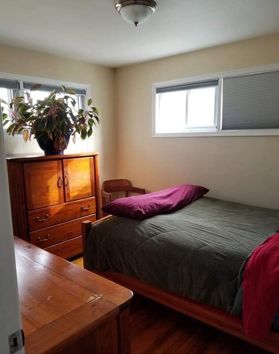 Queen bed with shared bathroom