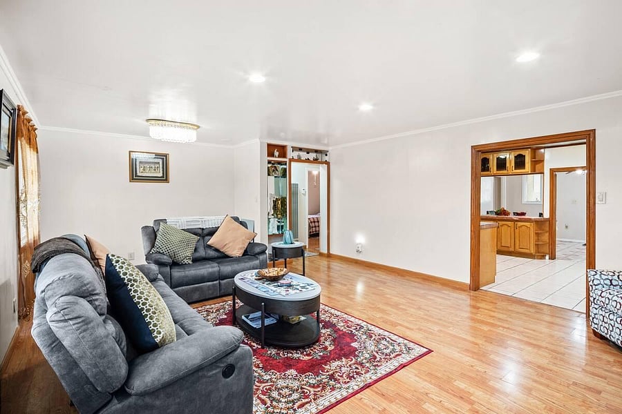 Living room with wide door ways to kitchen, Dinning room and side rooms