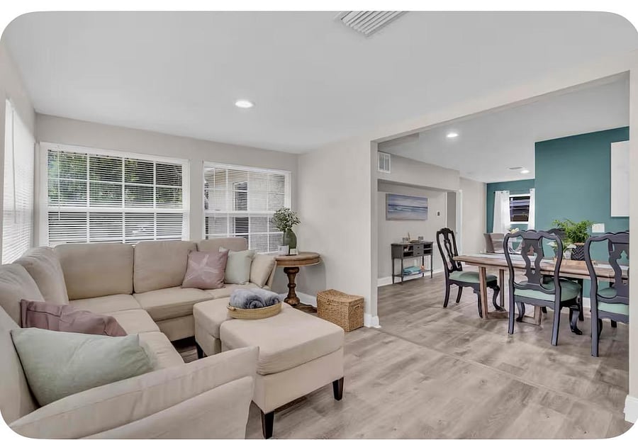 Large living room area with smart TV.