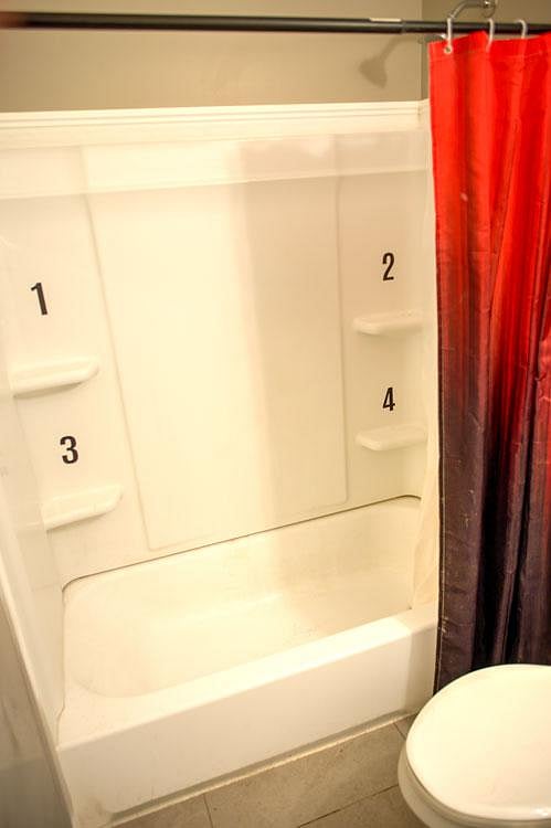 Full size bath and shower system with an individual shelf for each room.