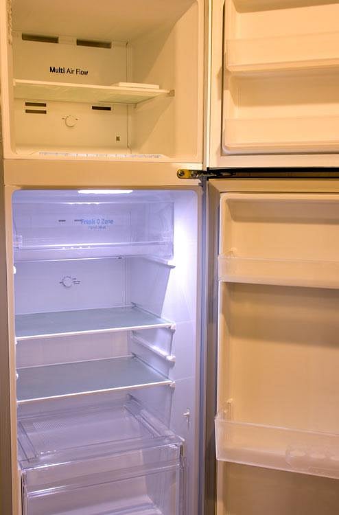 Refrigerator with adjustable shelving, door storage, and a freezer compartment for everyday meal prep.