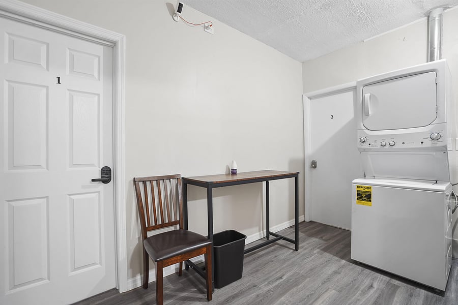 Laundry room w/seating area and table for folding clothes and/or resting laundry basket!