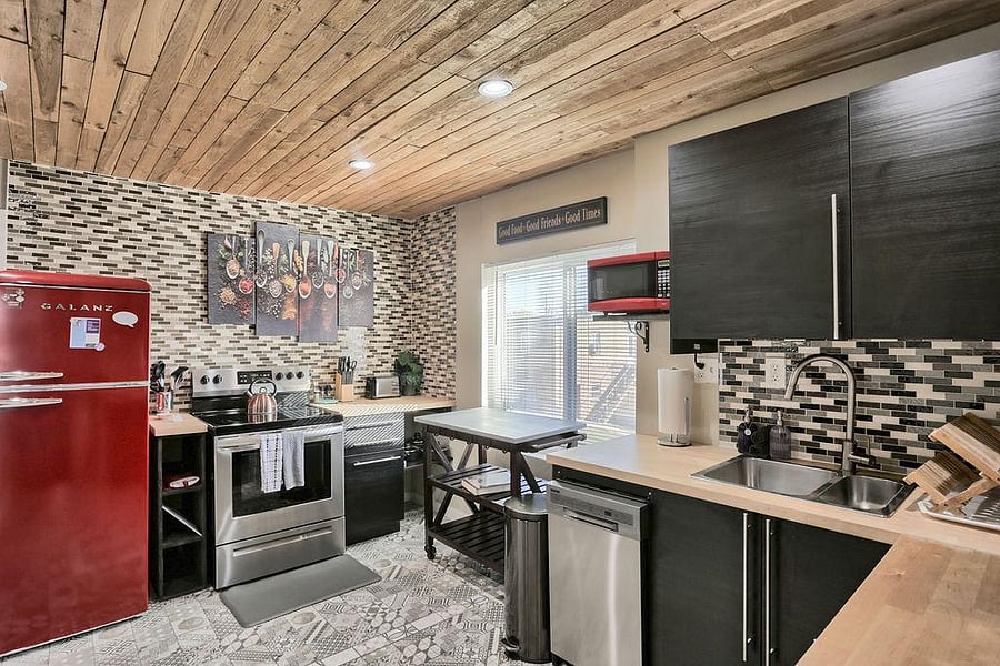Enjoy your shared modern kitchen with dishwasher and stainless steel appliances.