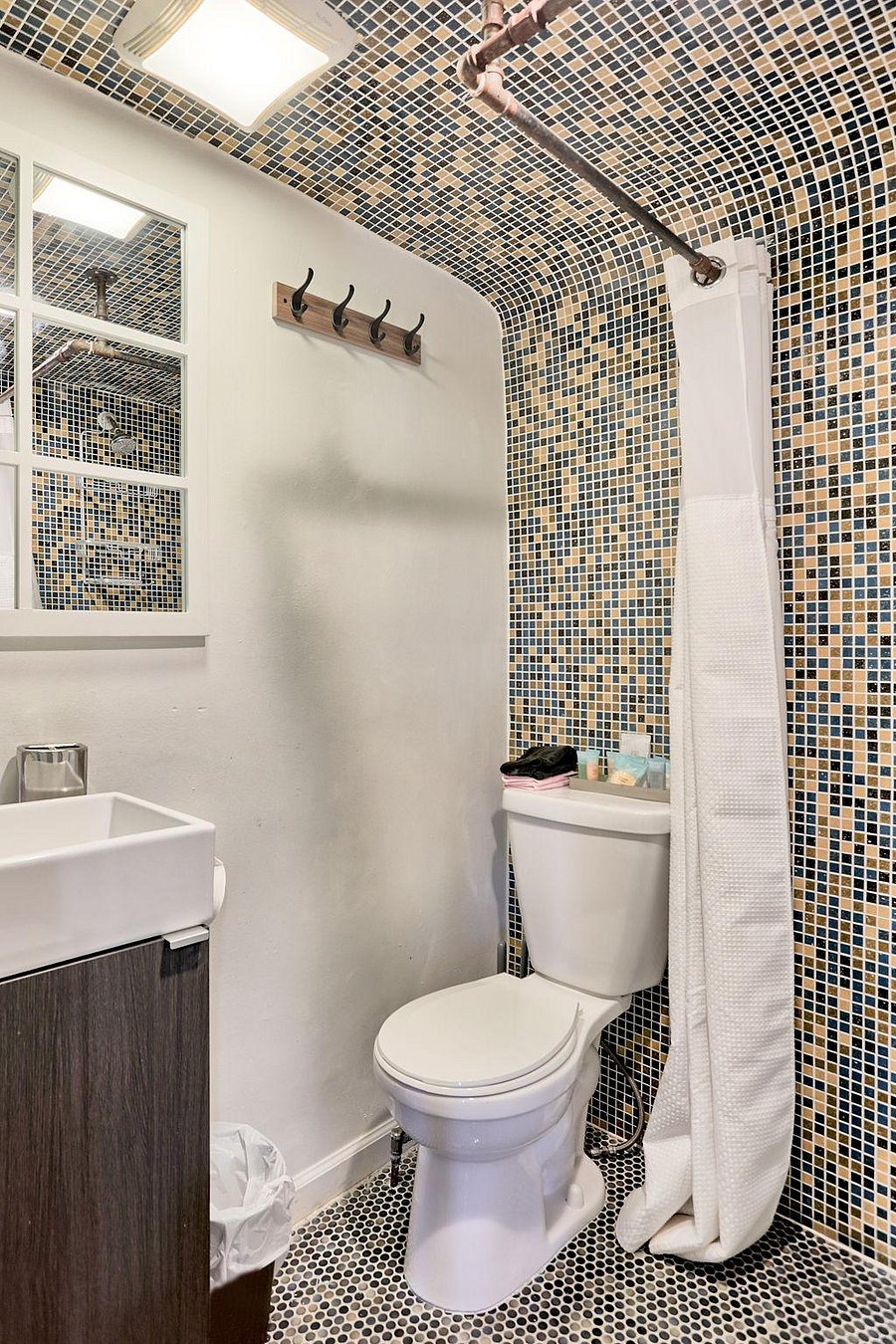 Upgraded Boho shared bathroom in the  hallway on the second floor.