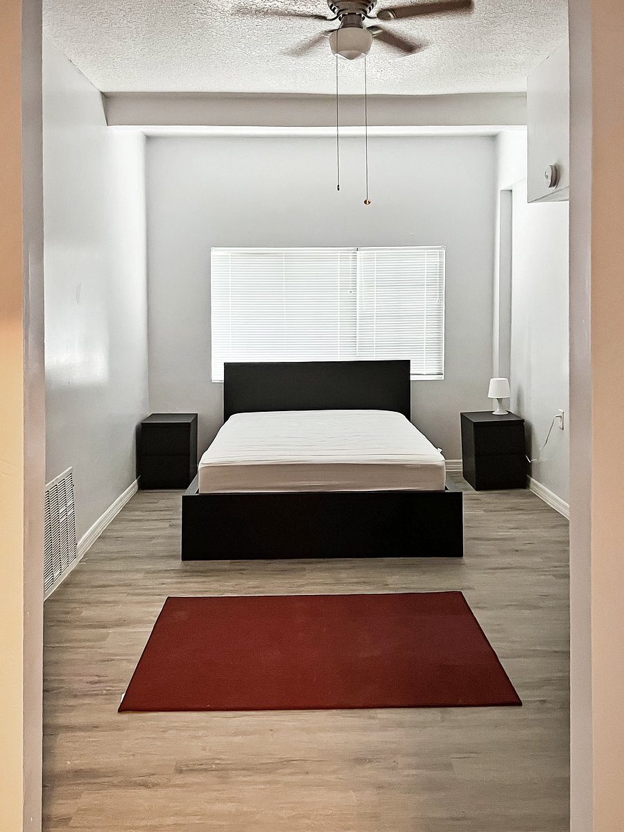 Oversized Large Room with night stands side table lamp and large armoire/chest .