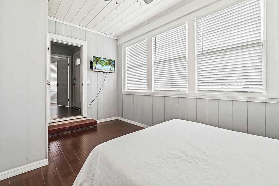 This room includes a TV and ceiling fan