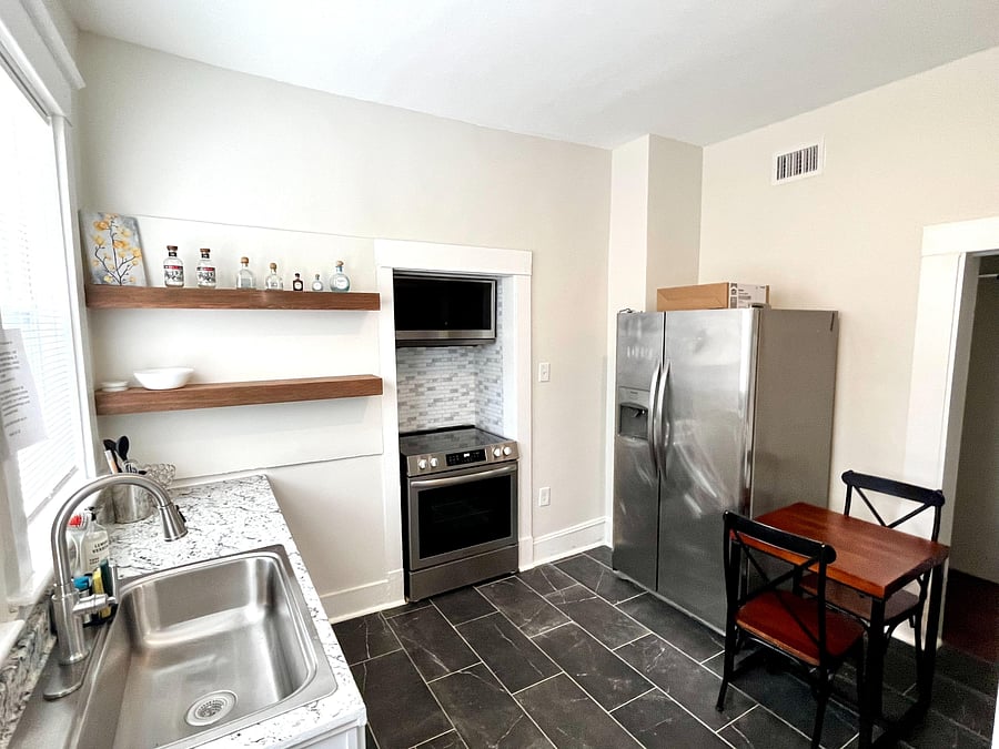Updated Kitchen with eat in corner, large sink, new stove and microwave