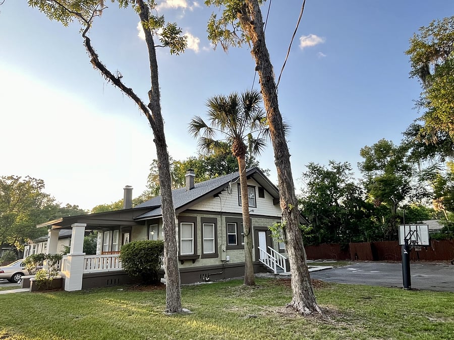 Large yard , welcoming Front Porch and even a basketball hoop & half court!
