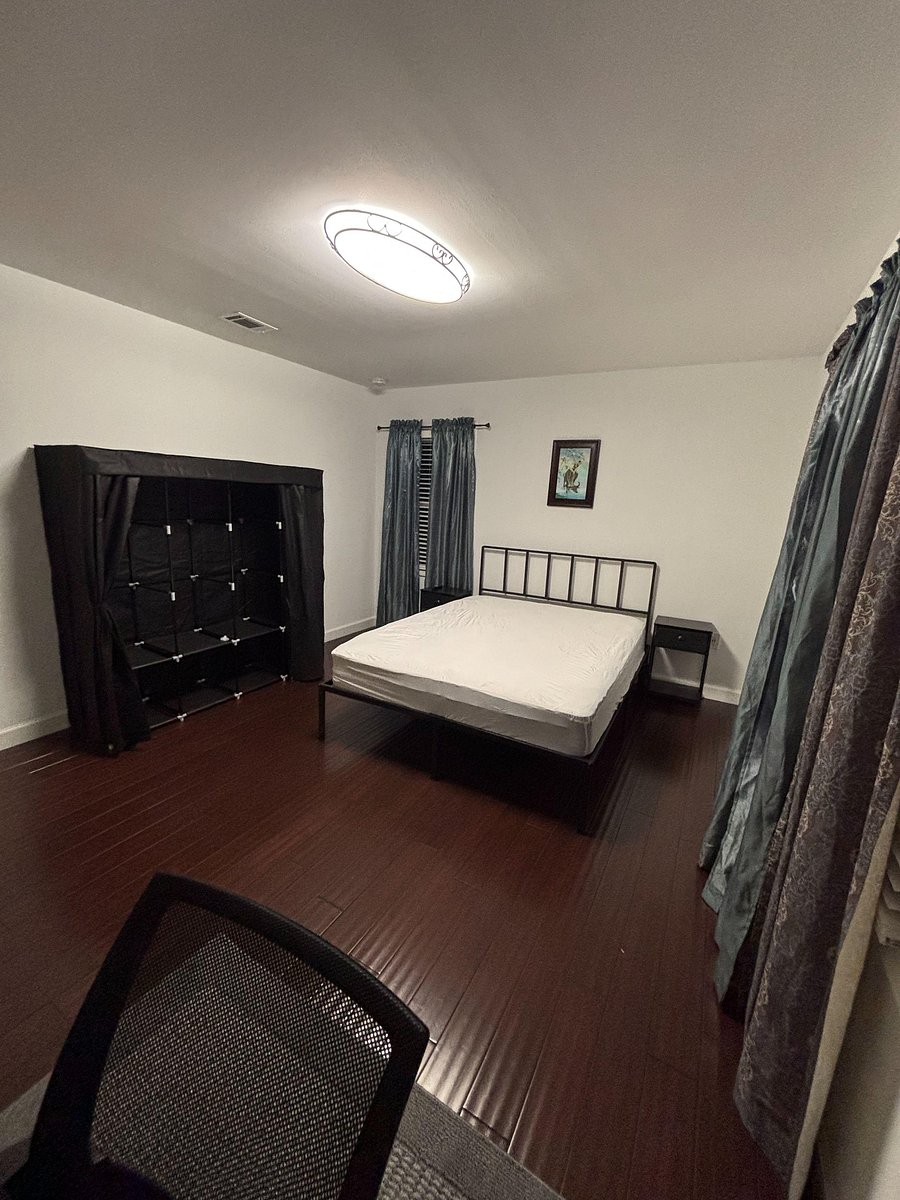 Large room with dresser and wardrobe.