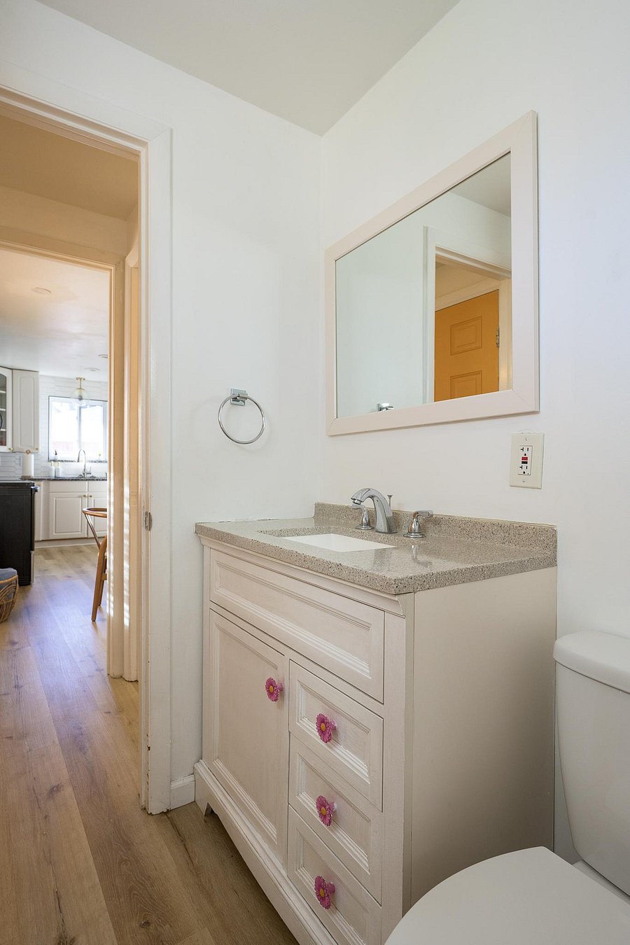Private half bath off the kitchen