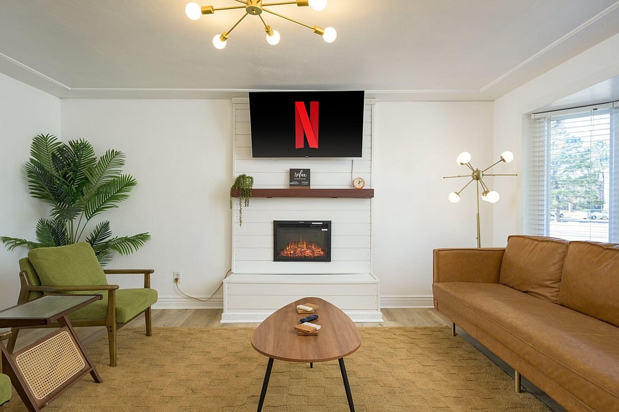 Main floor living room with 55" Roku Smart TV and seating for all. Large bay window for great natural light.