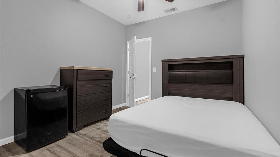 Bed, dresser and mini fridge
