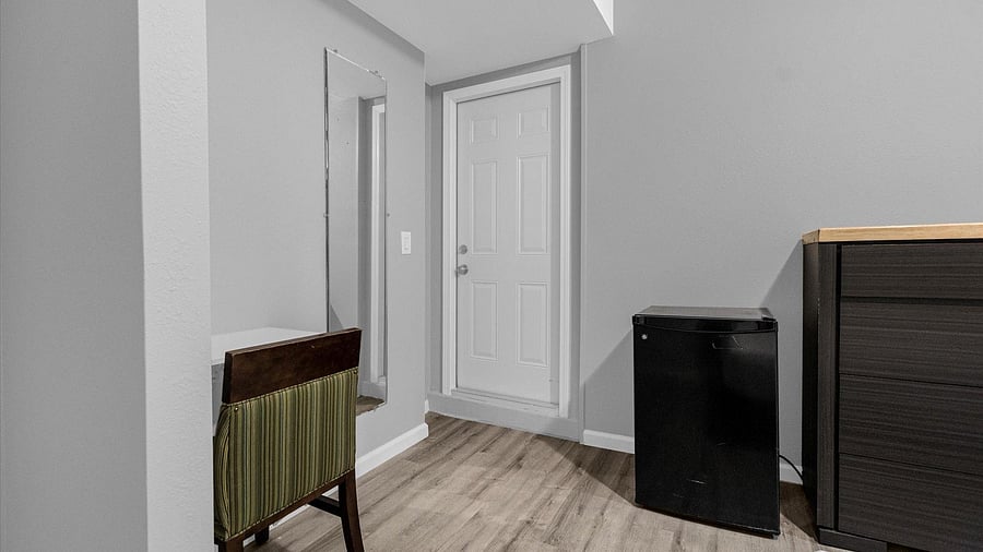 desk, chair and mini fridge