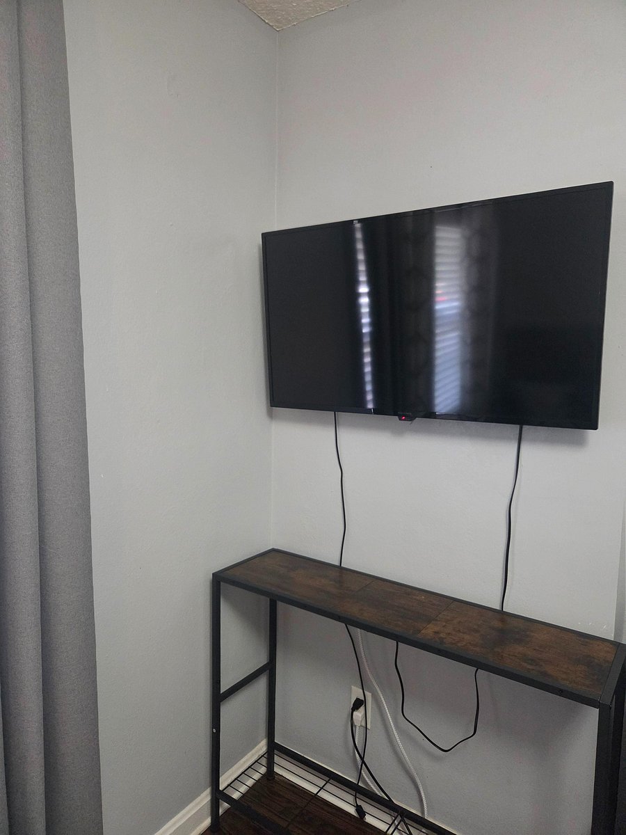 Wall-mounted Smart TV included in each room