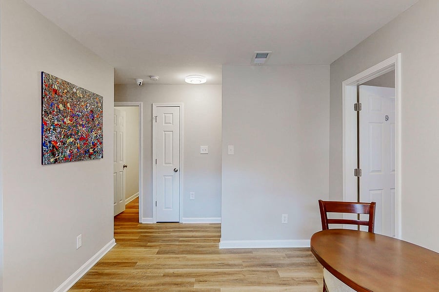 Upstairs hallway, dining and shared bath entrance.