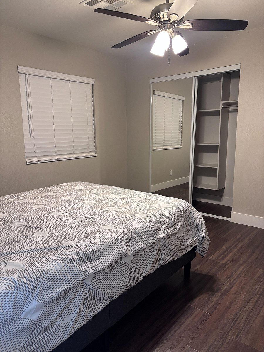 closet with mirrors and storage inside
