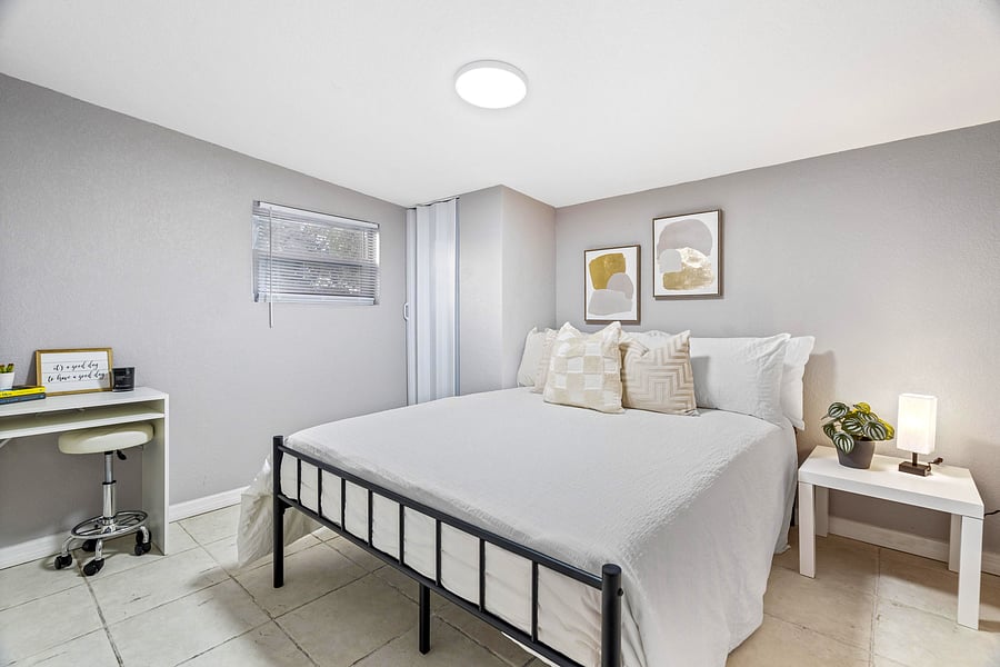 Queen size bed in large updated bedroom! *Disclaimer: This photo has been staged. Not all furnishings seen will be included