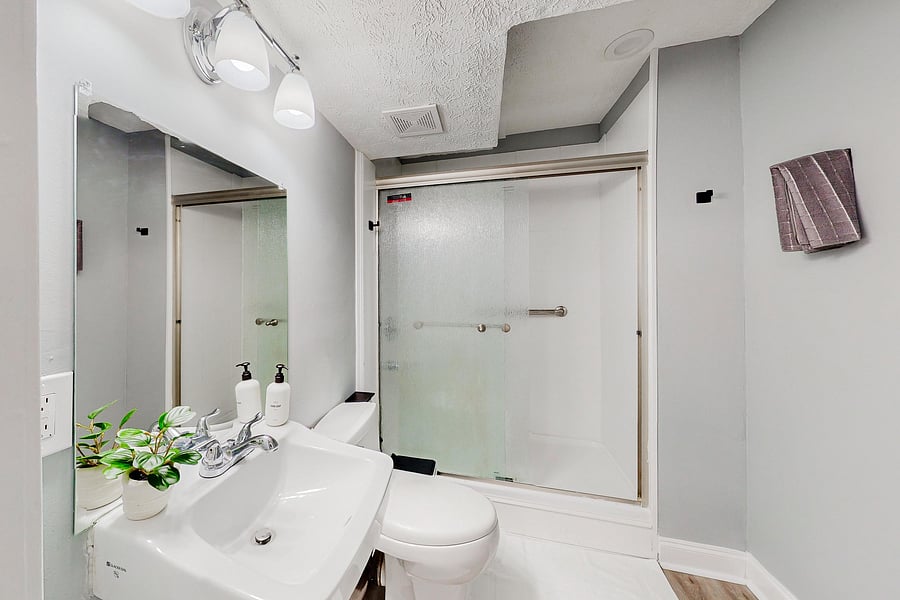 Full Bathroom with a standing shower located on the basement level