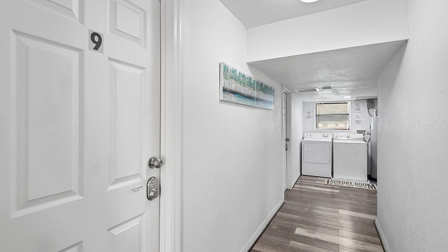 Convenient in-home laundry area with side-by-side washer and dryer.
