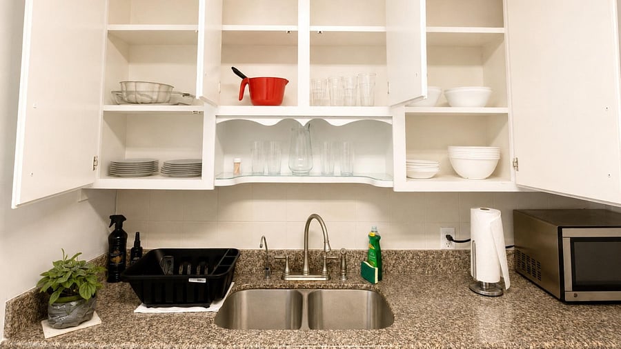 Kitchen area with double-basin sink, generous cabinet storage, and a spacious countertop for meal prep and cleanup.