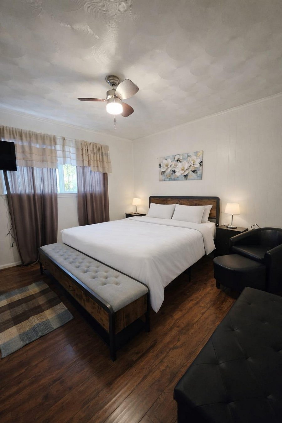 Spacious room with closet plus two storage bench and seating chair with ottoman