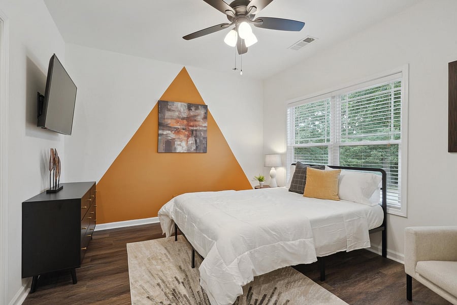 Includes a Queen-Sized Bed, Lounge Chair, and Large Desk Area