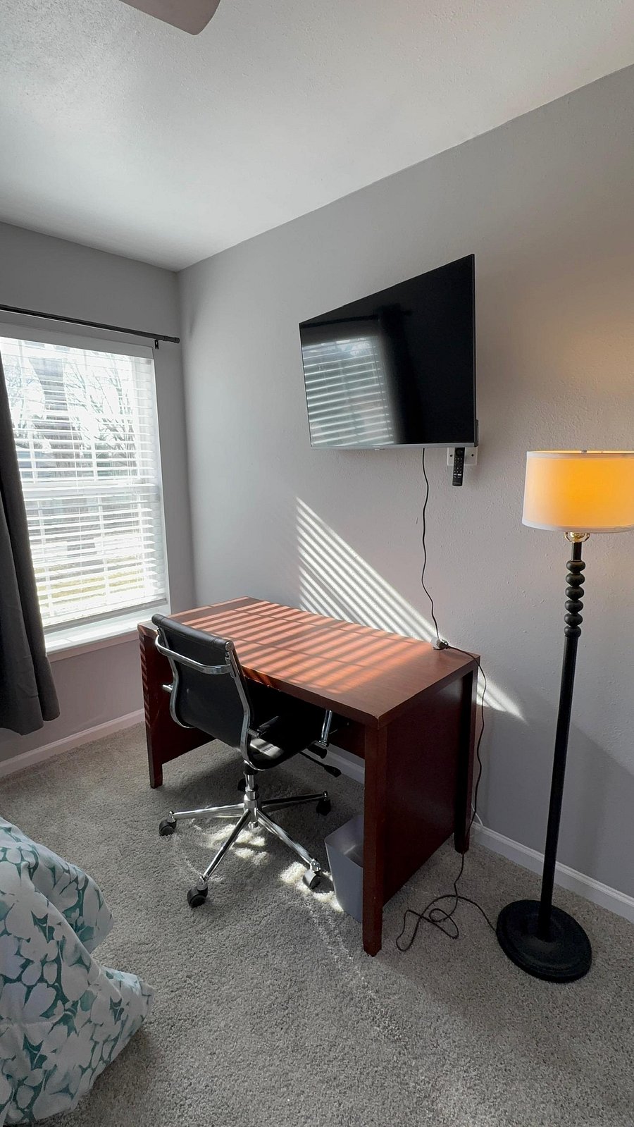 Work station with desk, ergonomic chair and a smart TV