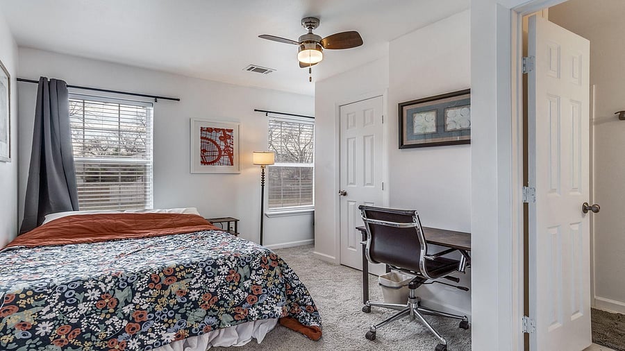 Comfortable bed and side table with built-in power outlets and work station