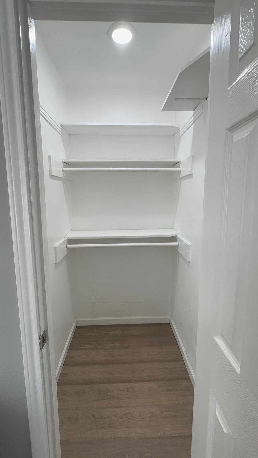 Spacious walk-in closet with built-in shelves