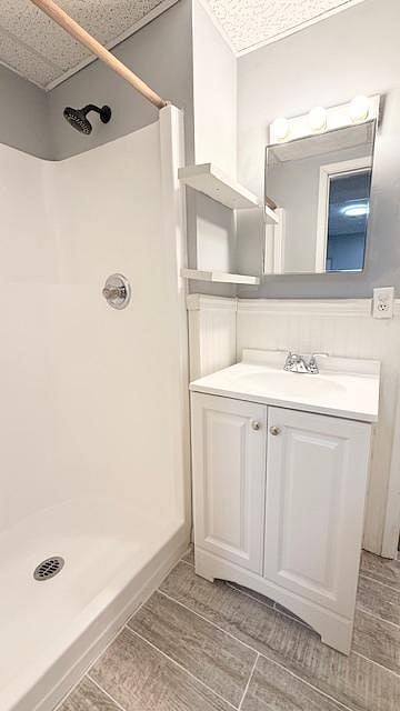 Full bathroom with shower that is shared with Room 5