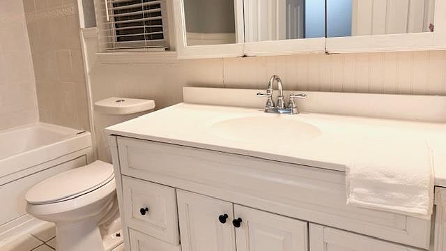 Full bathroom with bathtub